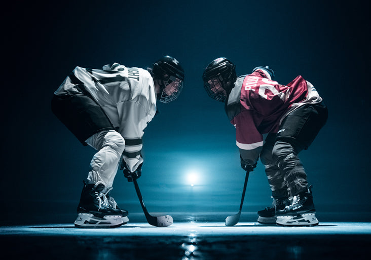 Hilary Knight and MP Poulin facing off on the ice
